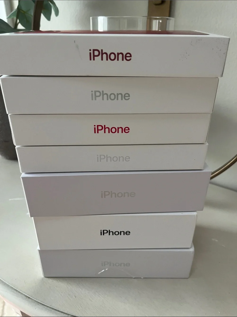 7 empty iPhone boxes
